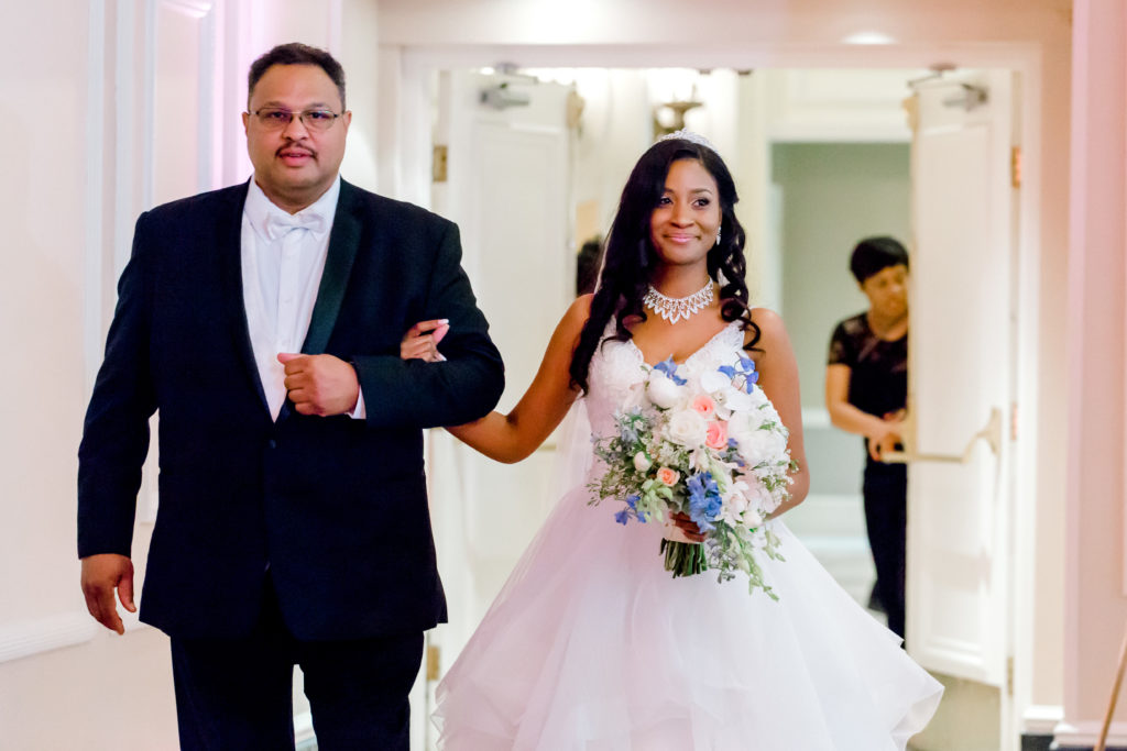 Brittany walking down the aisle with her dad
